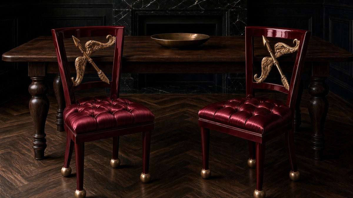 A pair of burgundy Cupid chairs at a dining table