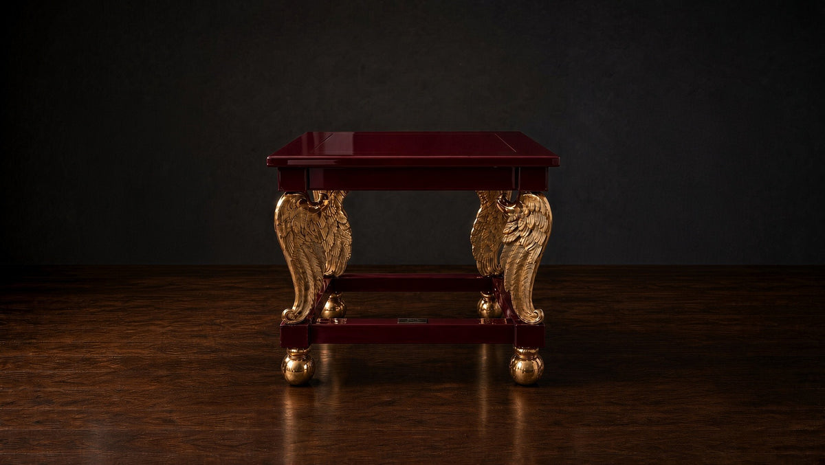 Cupid's Wings table in deep burgundy on a dark studio ground