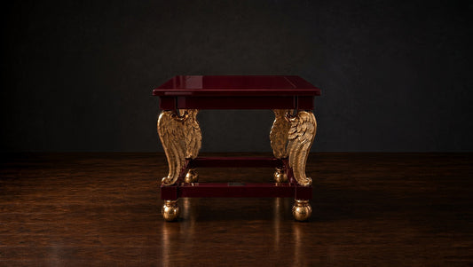 Cupid's Wings table in deep burgundy on a dark studio ground